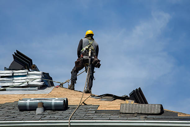 Professional Roof Replacement technician working in East Northport, NY